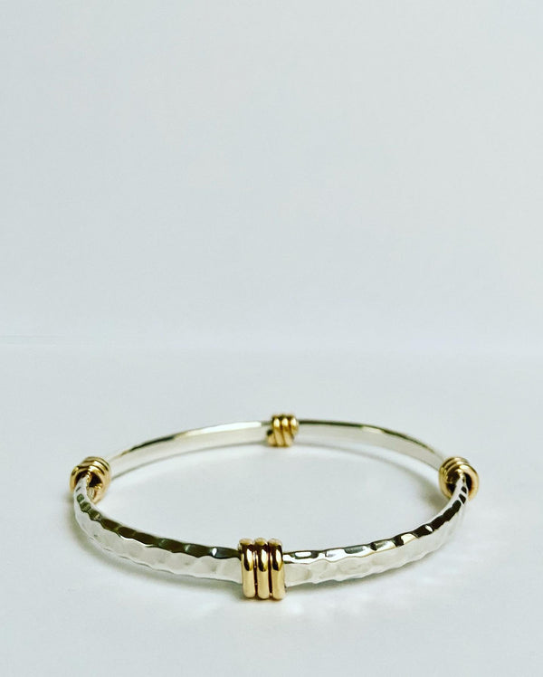 Hammered thin bangle with brass accent